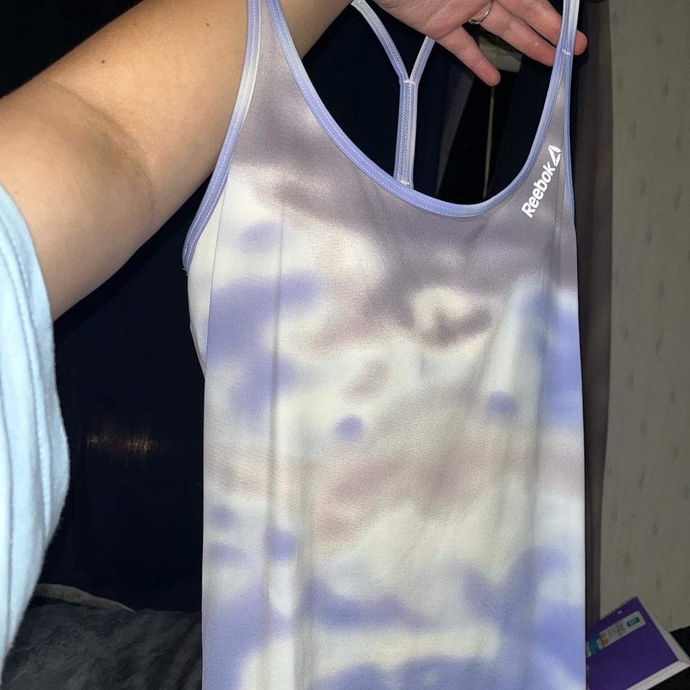 Reebok sports tank top with built in bra. No stains, no rips/tears, barely worn.